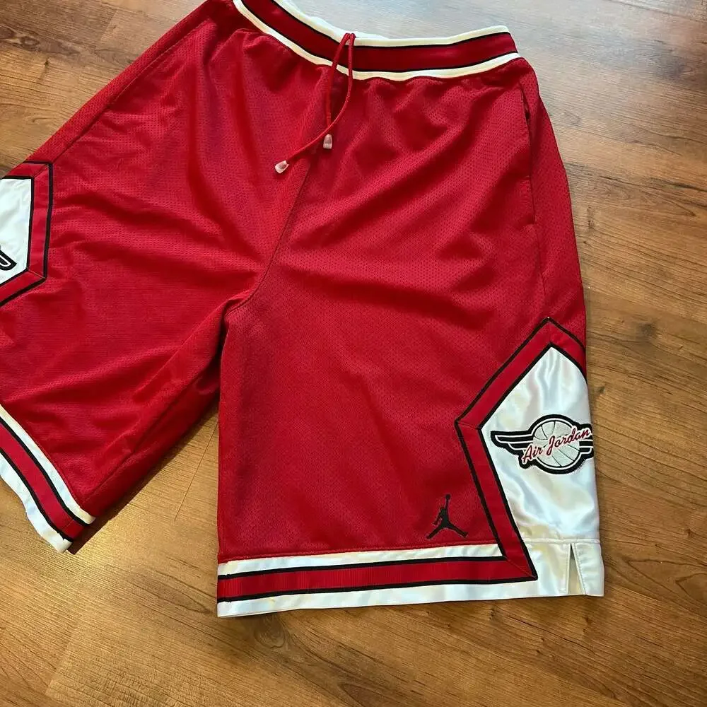Vintage 80s/90s OG Air Jordan Wings Mesh Basketball Shorts Red & White Size L